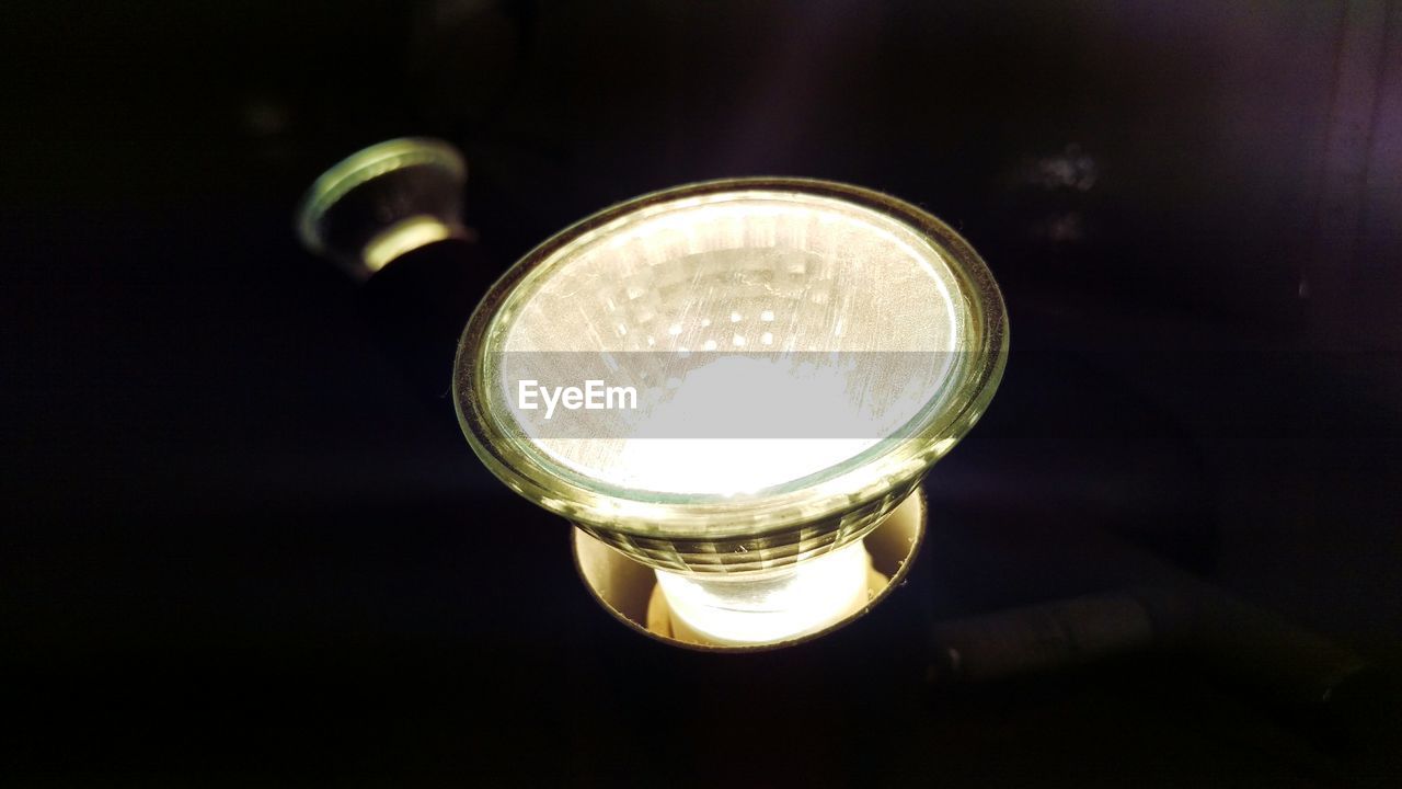 CLOSE-UP OF LAMP ON TABLE