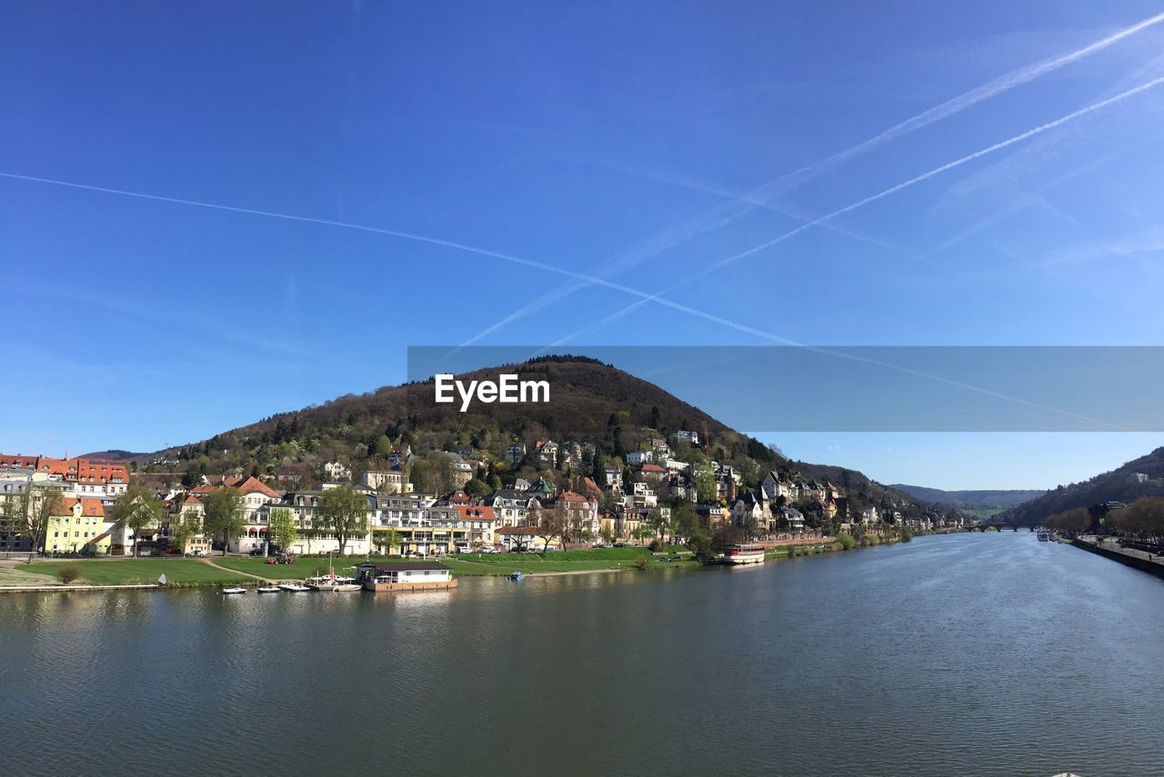 SCENIC VIEW OF TOWN BY BUILDINGS AGAINST SKY