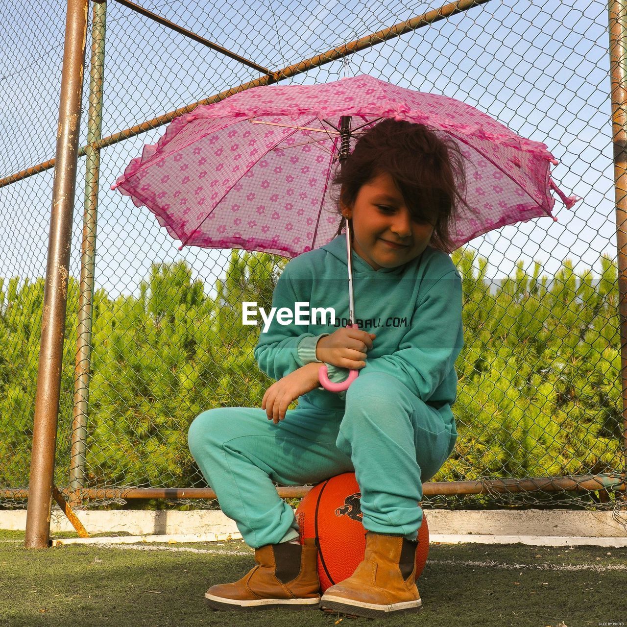 FULL LENGTH OF BOY SITTING IN RAIN