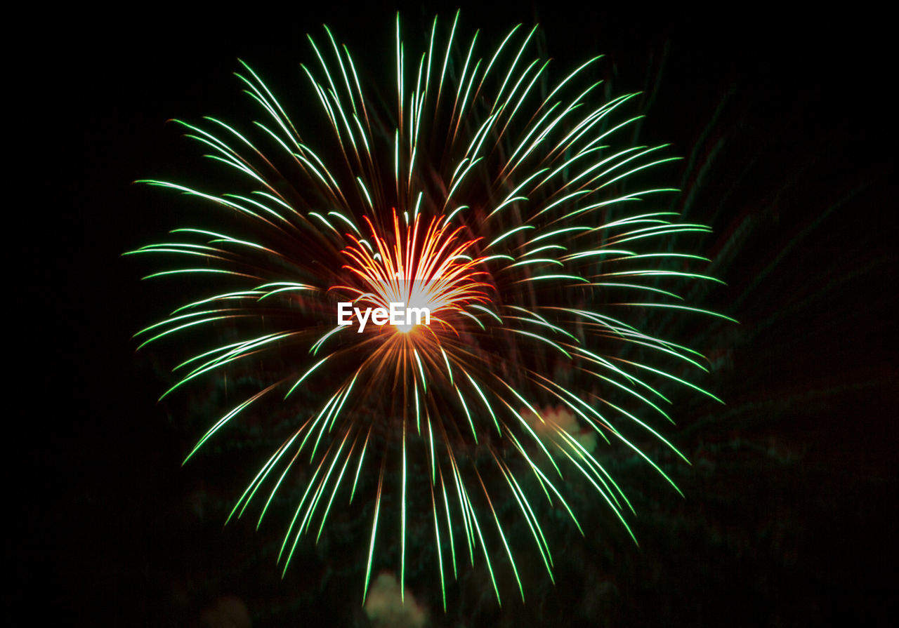 LOW ANGLE VIEW OF FIREWORK DISPLAY