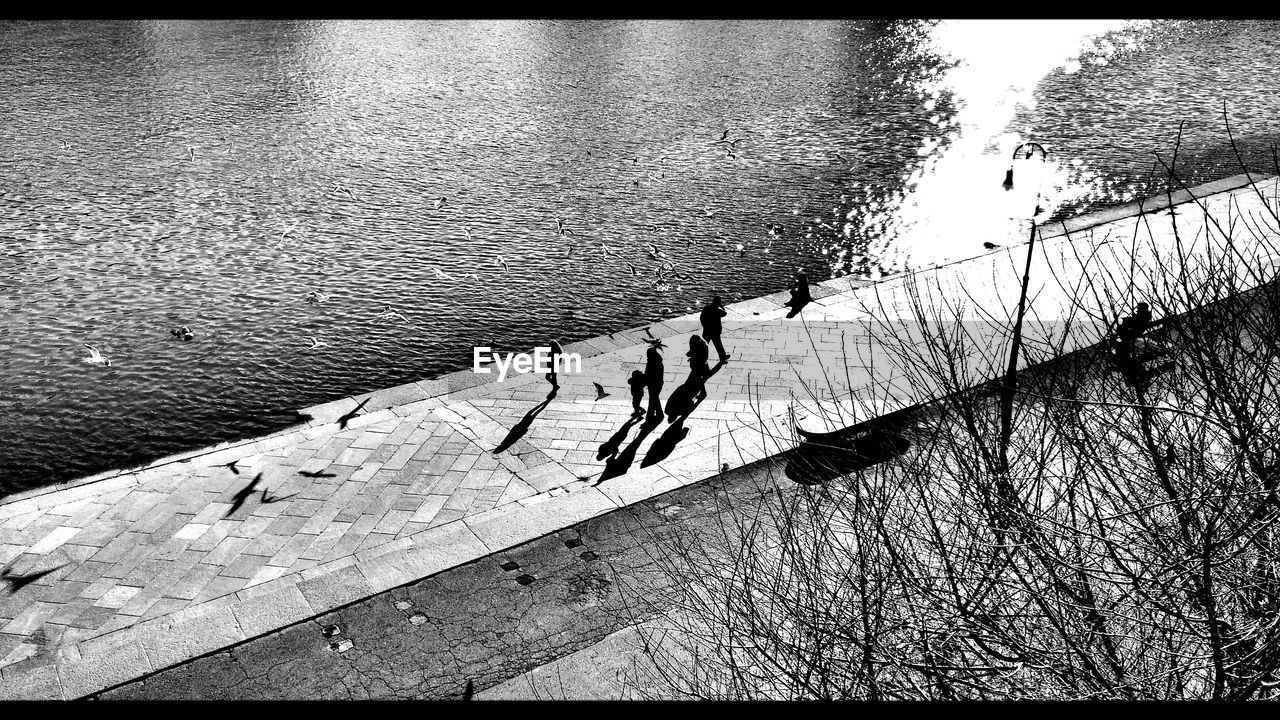 High angle view of people at lakeshore