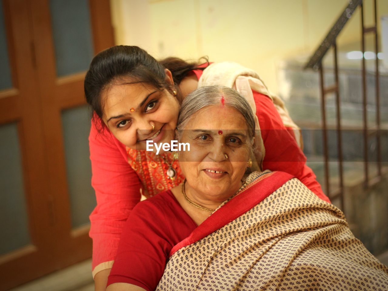 Portrait of happy grandmother with granddaughter