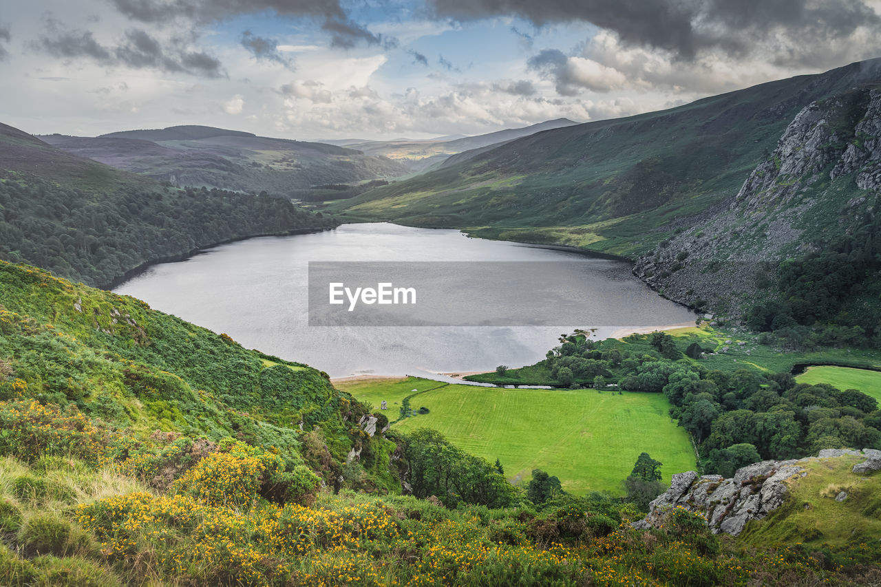 Dramatic sky over lough tay called the guinness lake in wicklow mountains