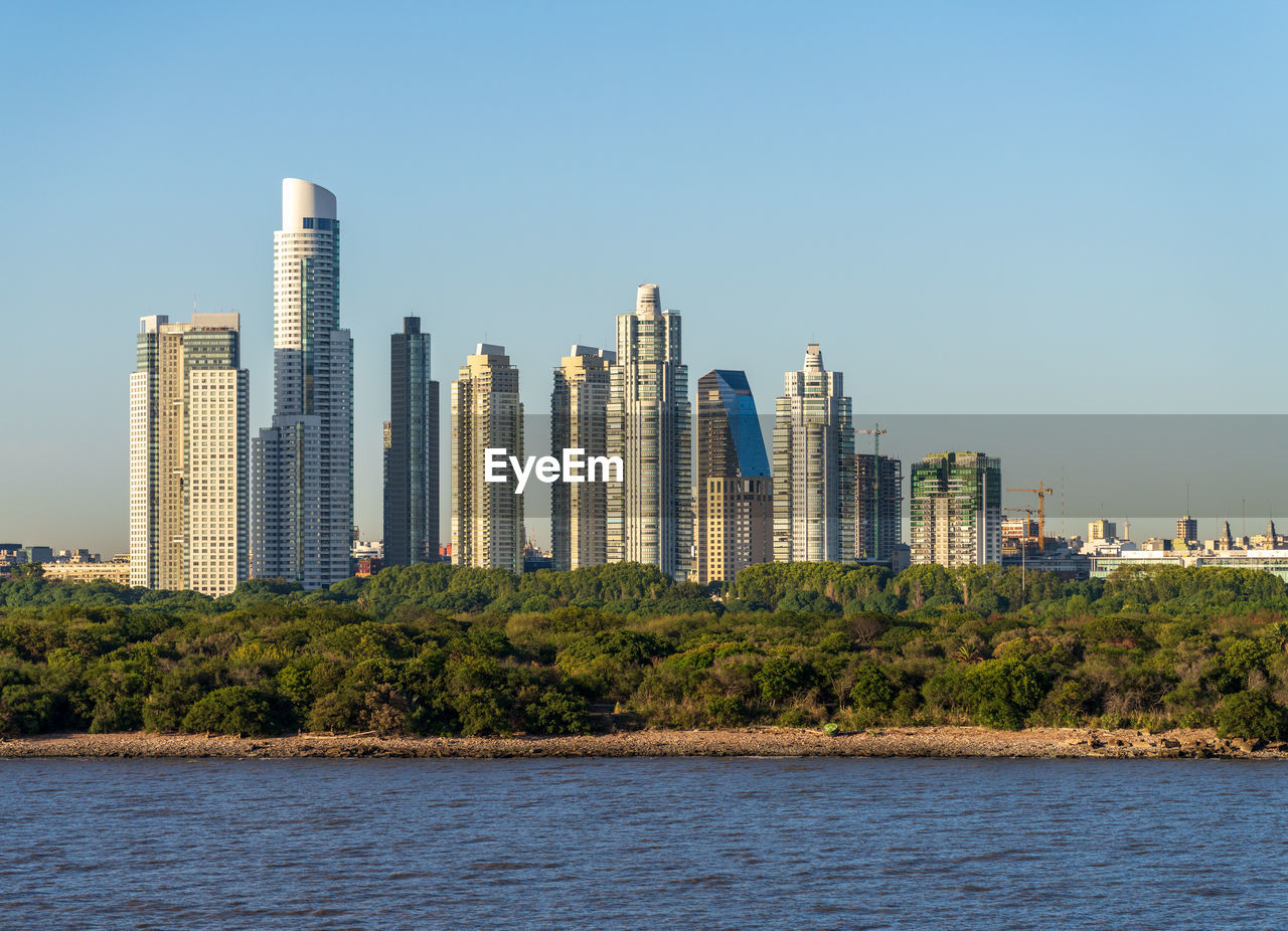 modern buildings in city against clear sky