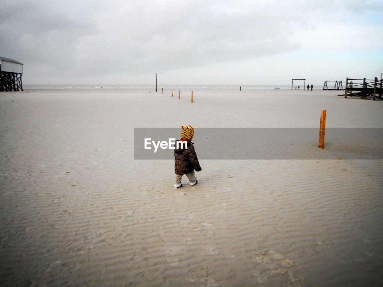 FULL LENGTH OF BOY ON BEACH