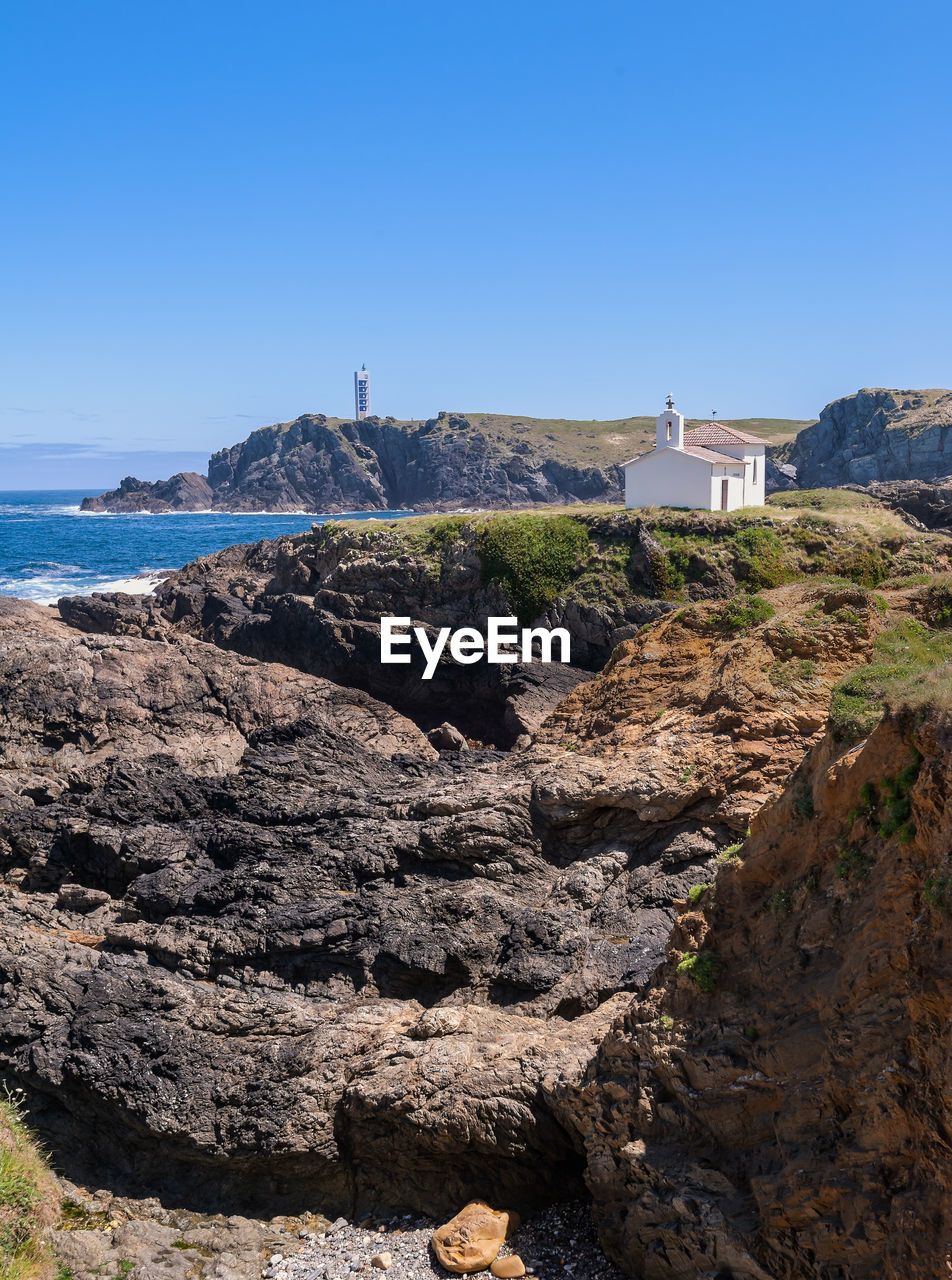 Scenic view of sea against clear blue sky