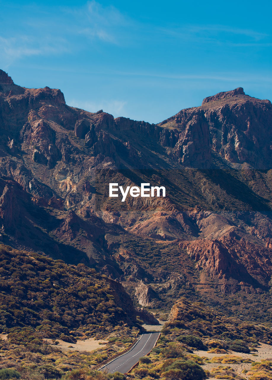 High angle view of road amidst mountains against sky