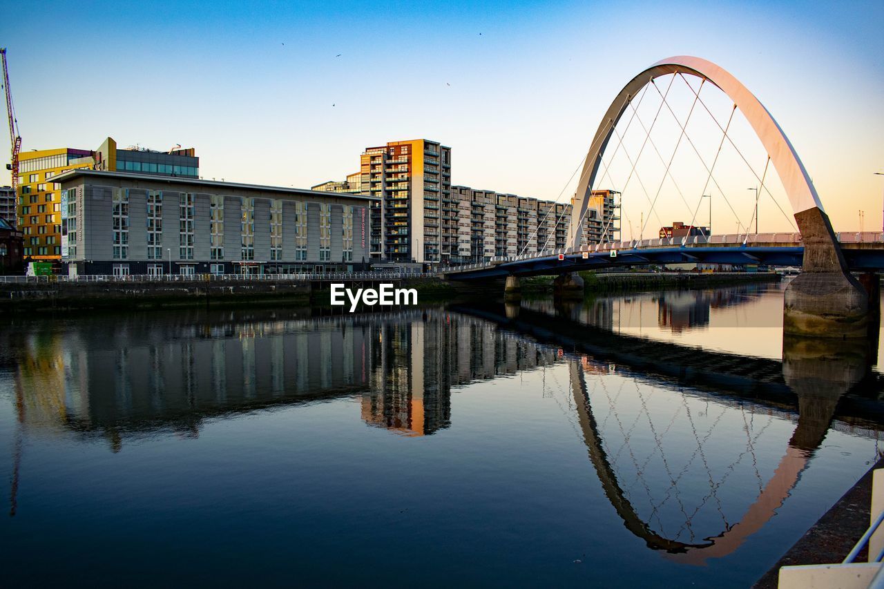 Bridge over river with buildings in background glasgow