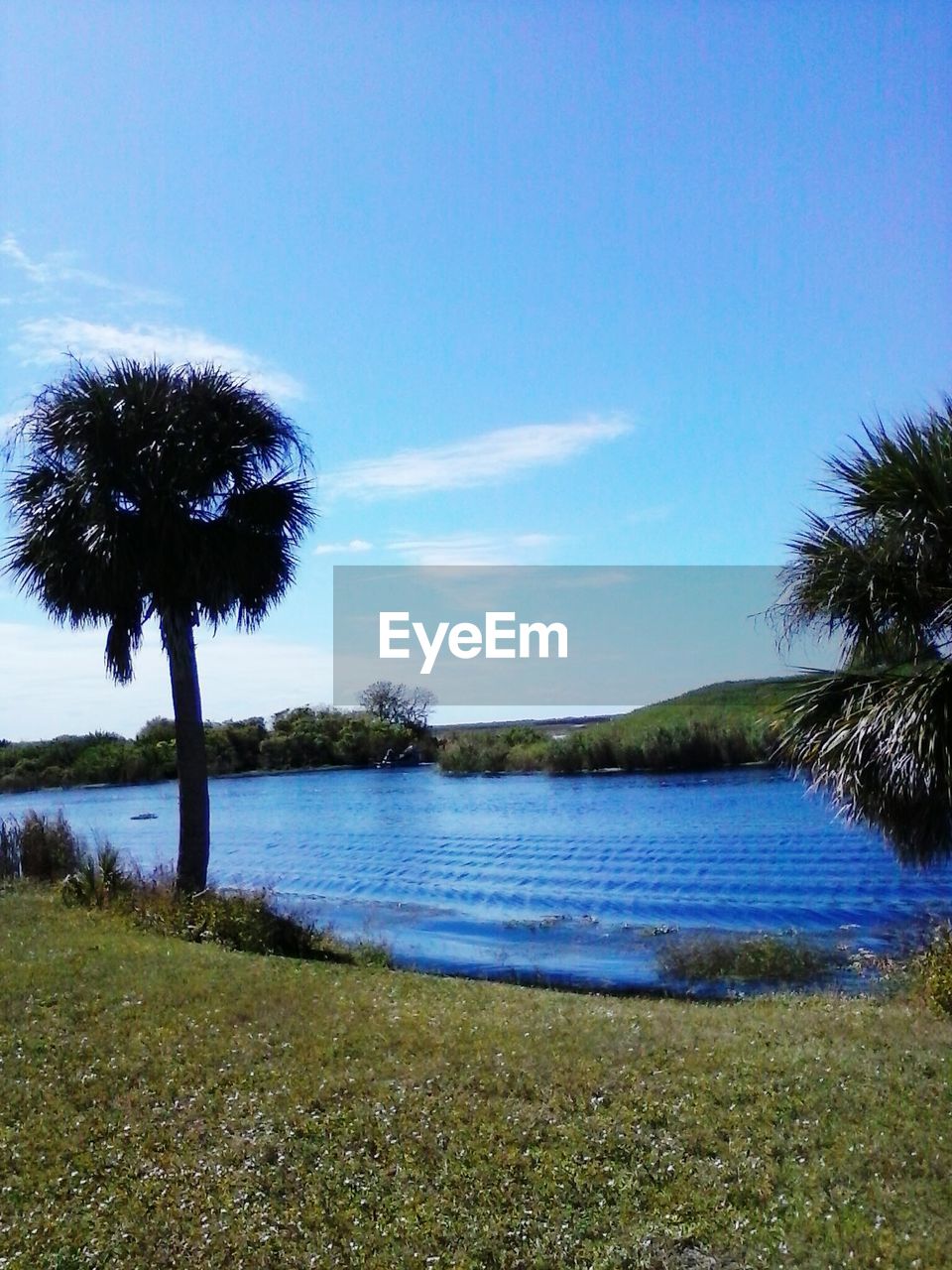 Idyllic view of lake against sky