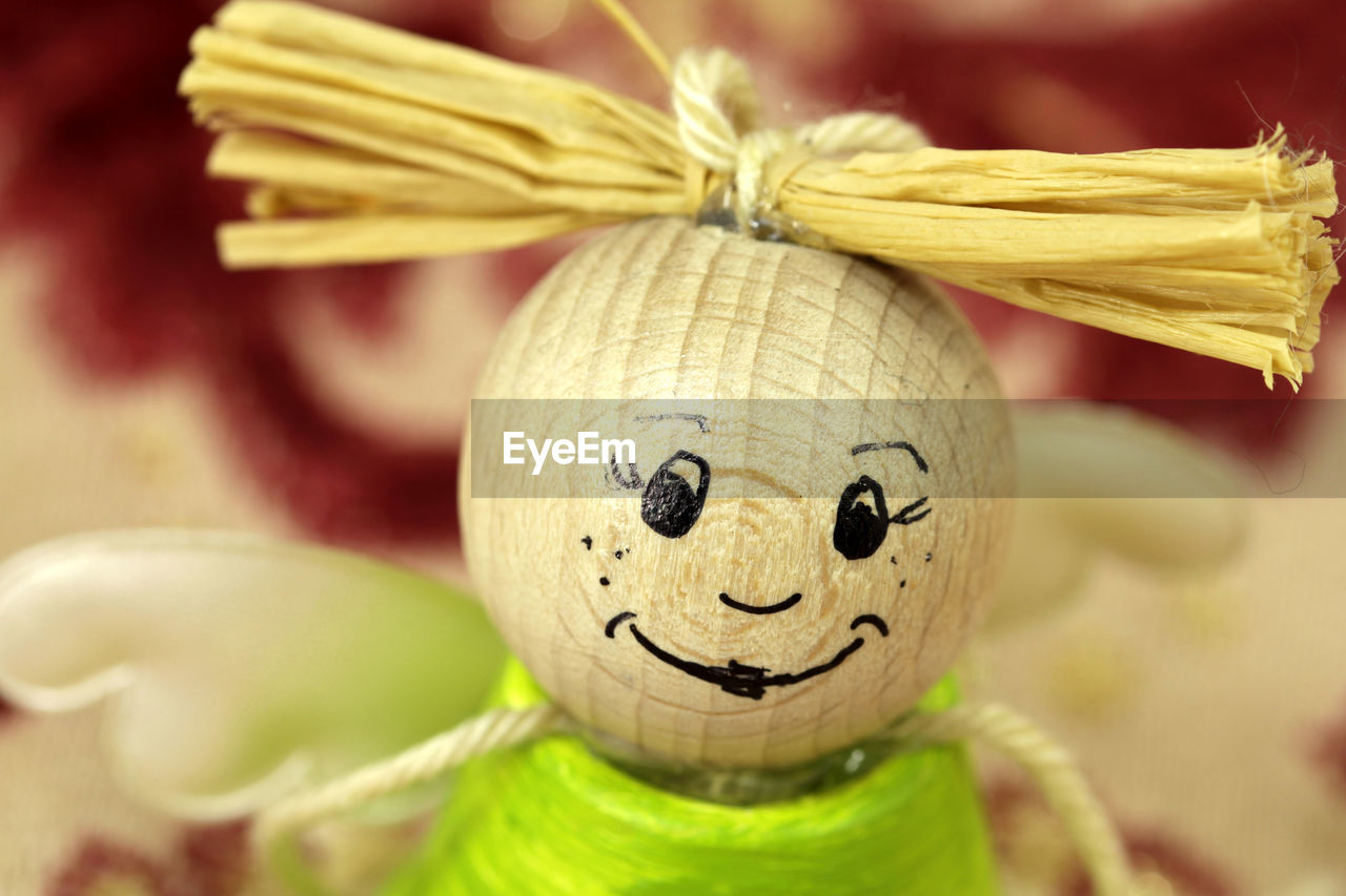 CLOSE-UP OF HUMAN FACE ON CUTTING BOARD