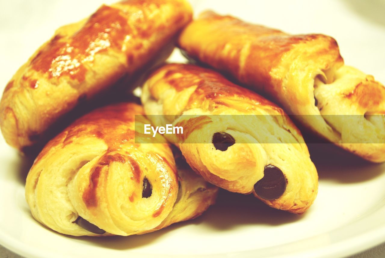 Close-up of fresh homemade croissant served in plate