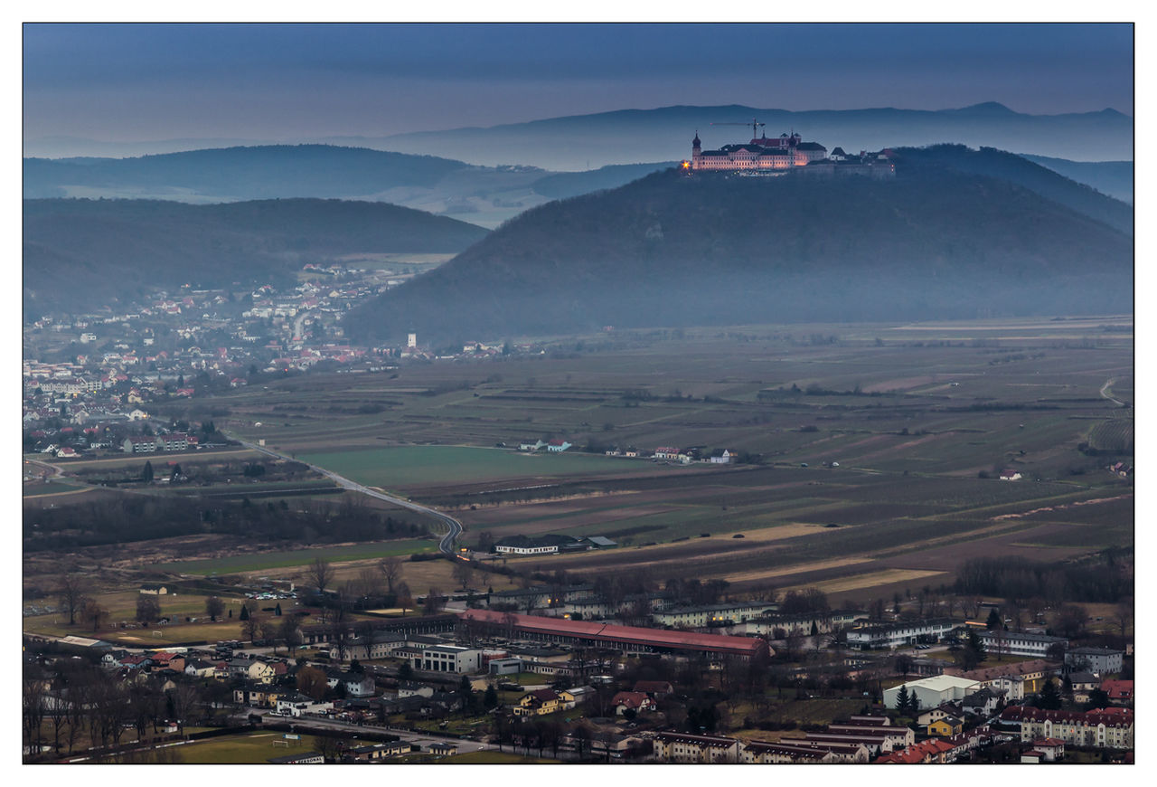 High angle view of village and agricultural fields