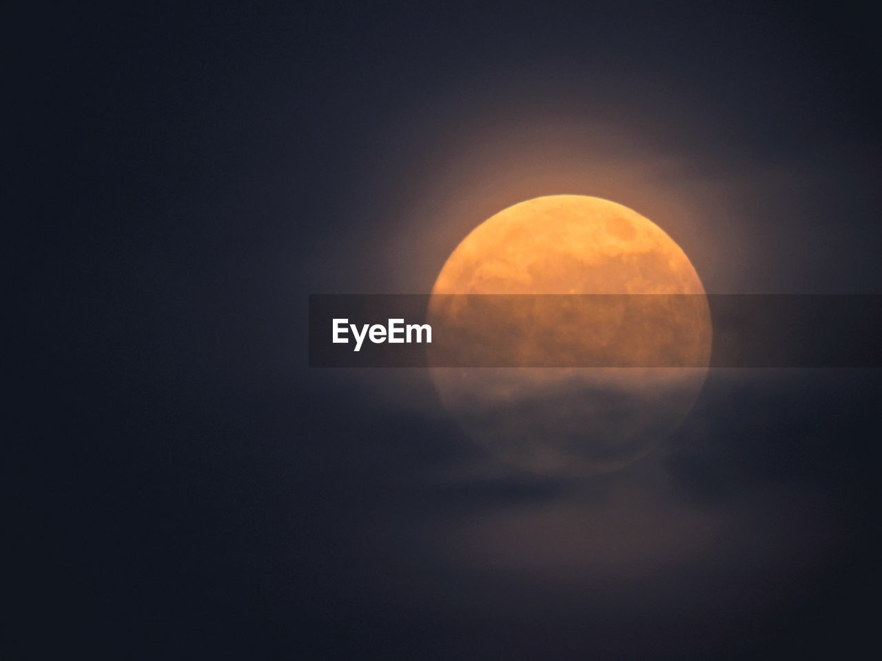 Low angle view of moon against sky at night