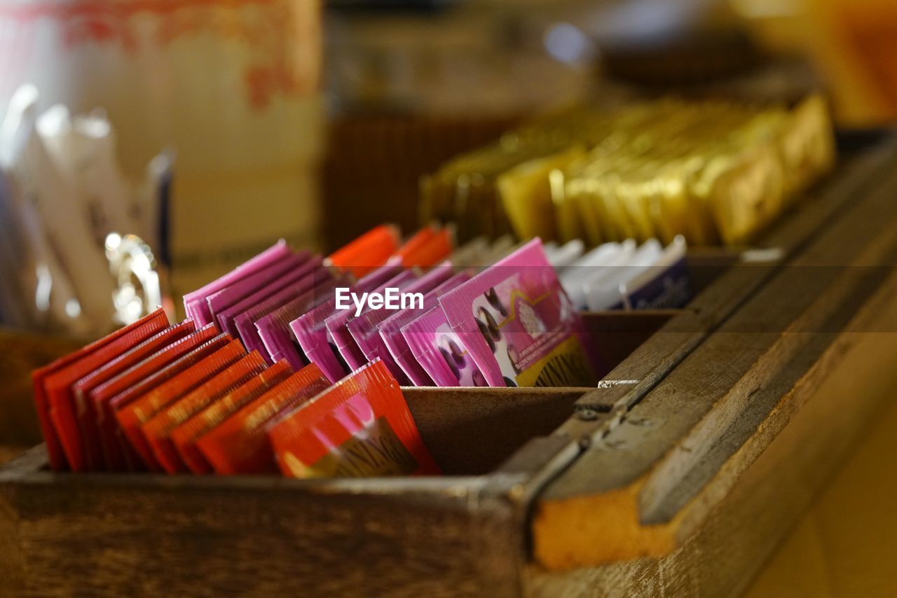 CLOSE UP OF COLORED PENCILS ON TABLE