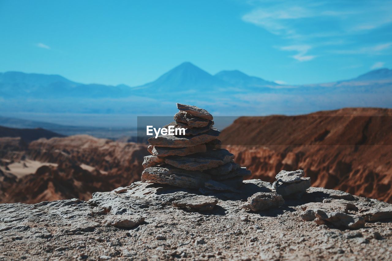 Pile of stones with mountain in background