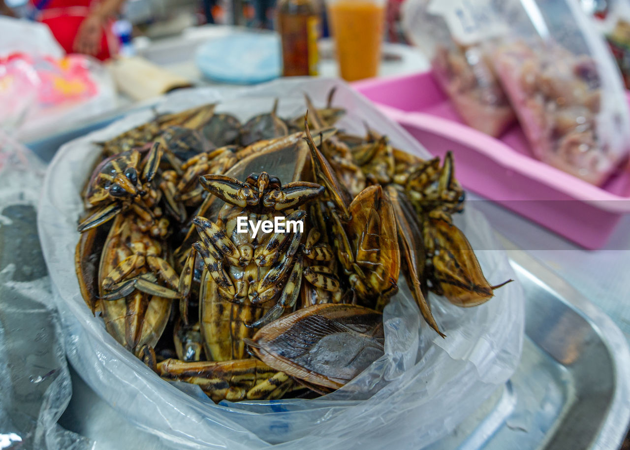 food and drink, food, freshness, market, container, no people, animal, healthy eating, seafood, drink, business, close-up, wellbeing, plate, retail, for sale, abundance, market stall, animal themes, cuisine, dish, focus on foreground, fish, large group of objects