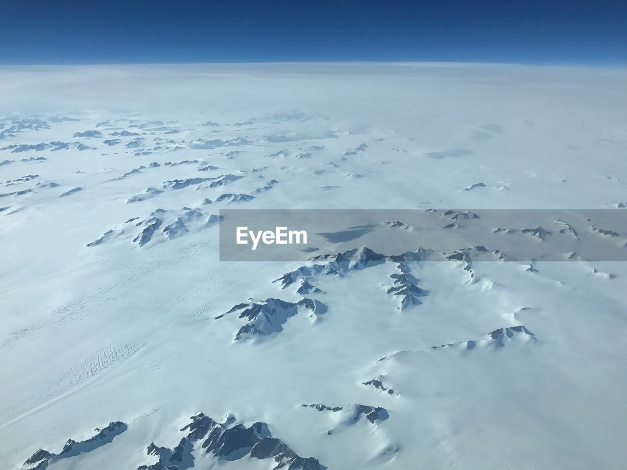 Aerial view of frozen sea against sky