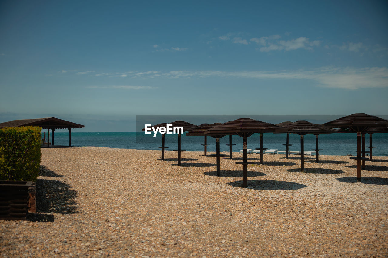 GAZEBO ON BEACH AGAINST SKY