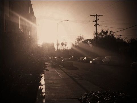 ROAD PASSING THROUGH CITY DURING SUNSET