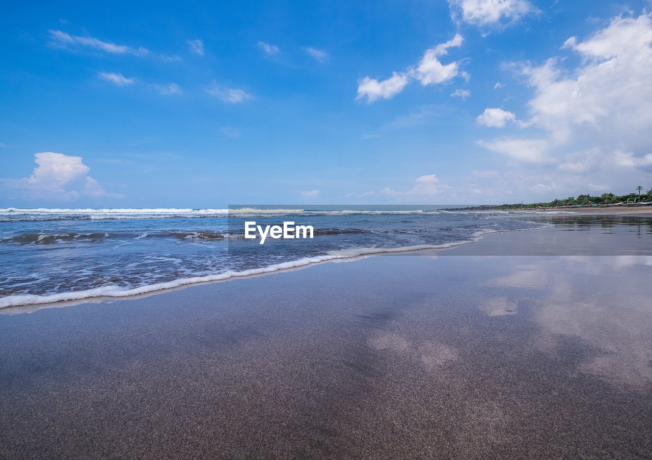 View of beach against cloudy sky