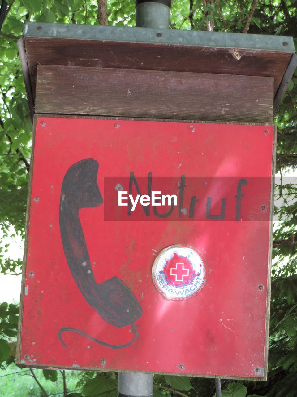 CLOSE-UP OF SIGN ON OLD METAL