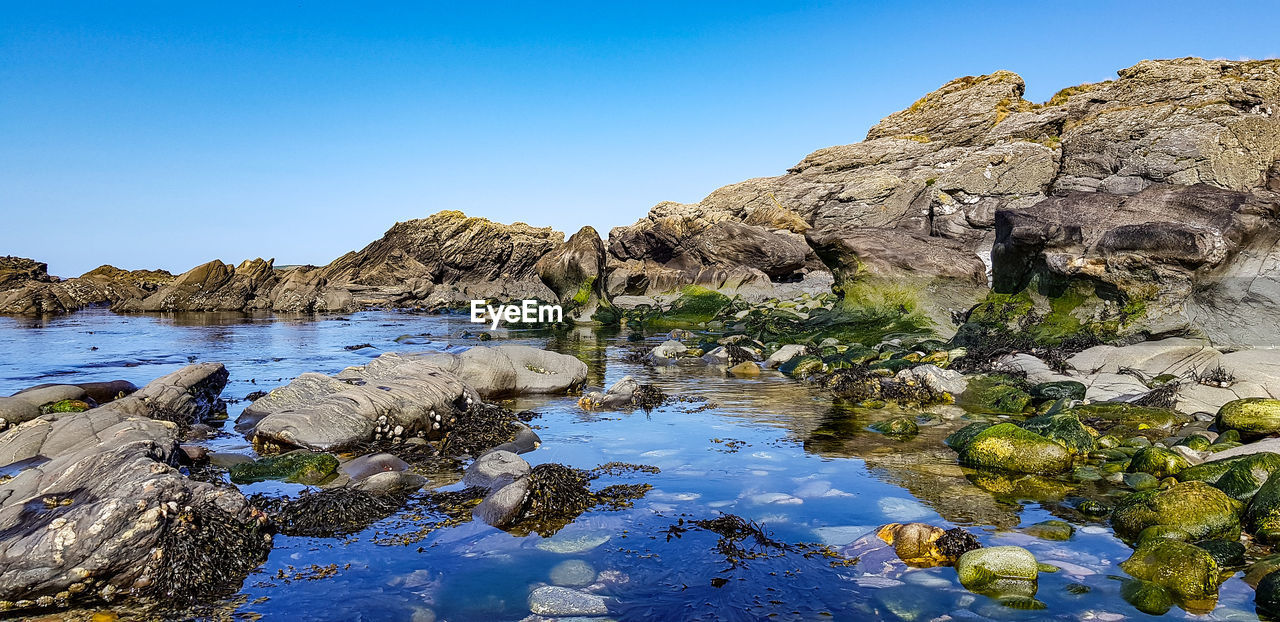 Rock formations against blue sky