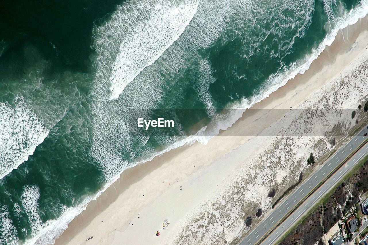 WAVES ON SHORE AT BEACH