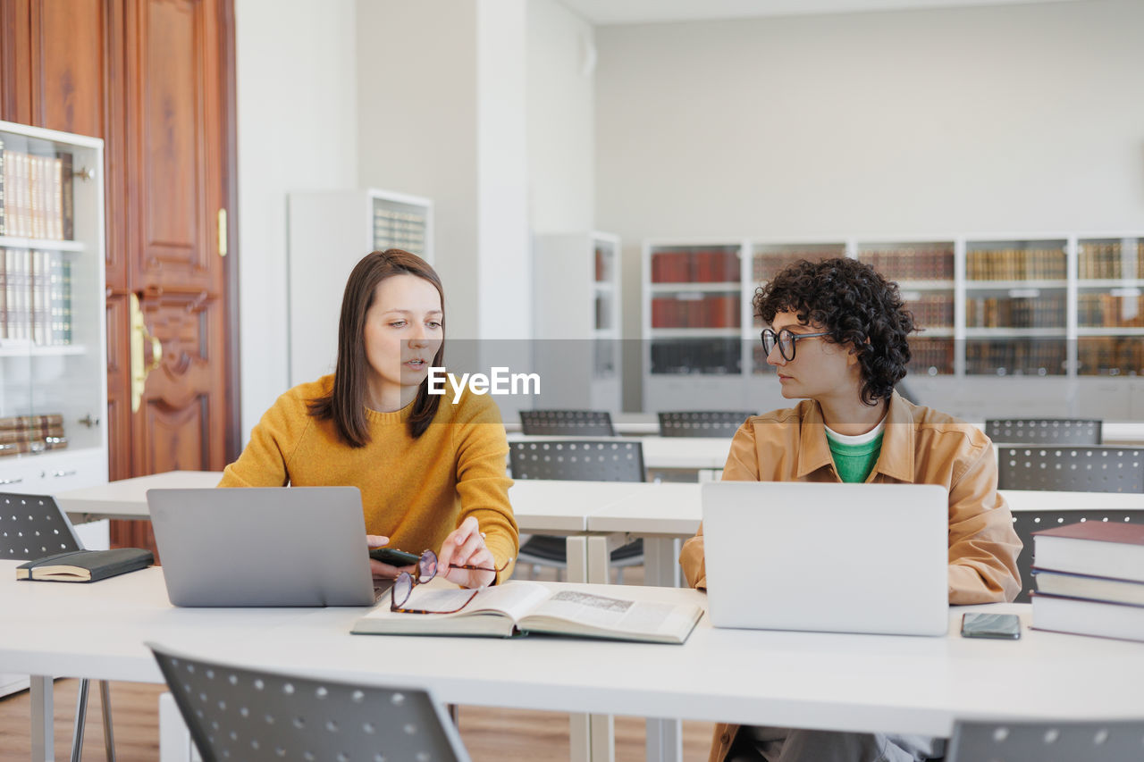 businesswoman working on table in office