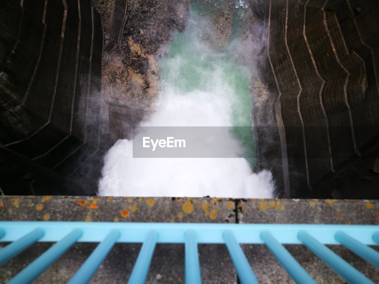 HIGH ANGLE VIEW OF SMOKE EMITTING FROM CHIMNEY ON BARBECUE