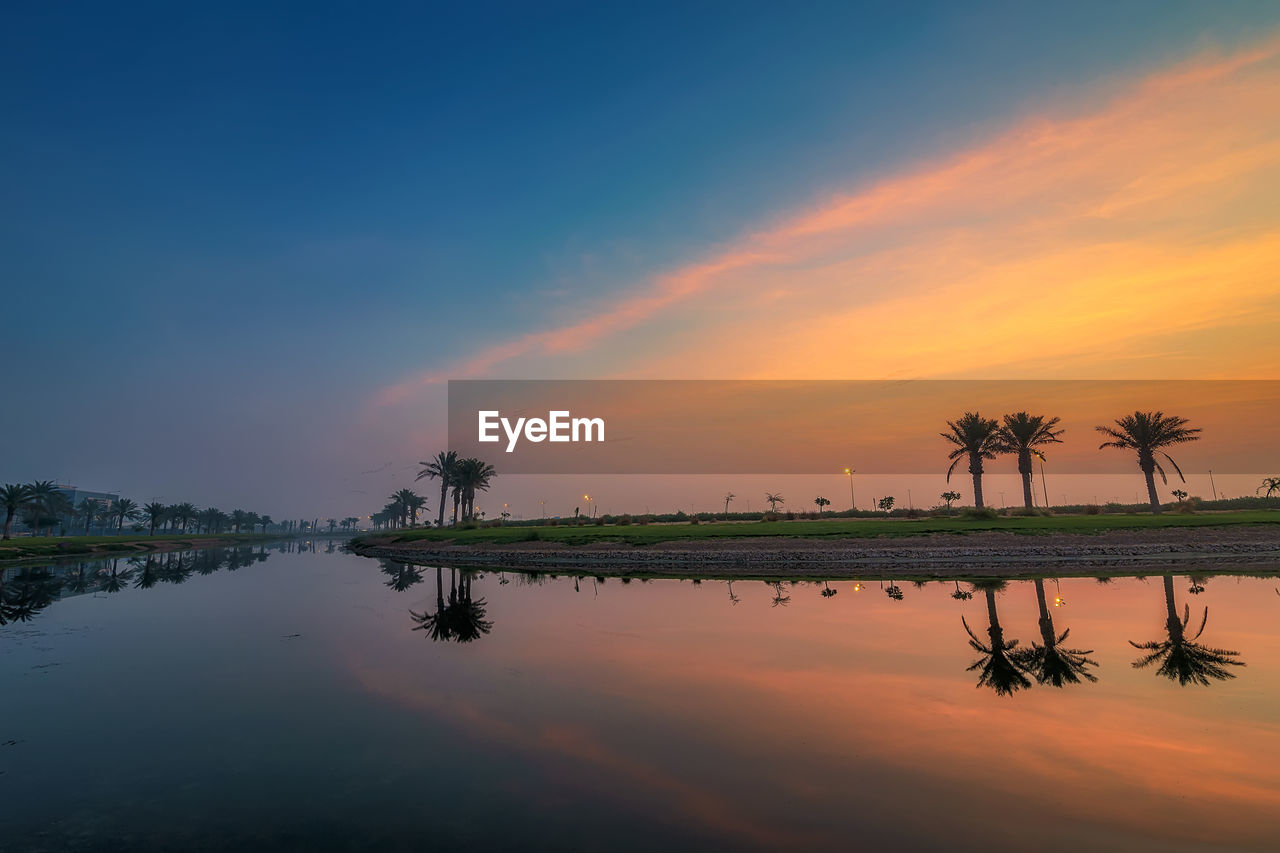 SCENIC VIEW OF LAKE DURING SUNSET