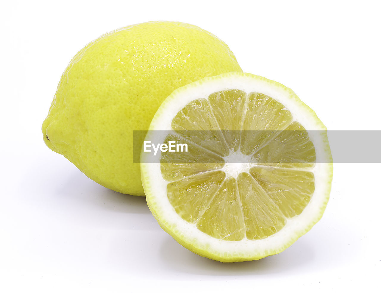 Close-up of lemon slice against white background