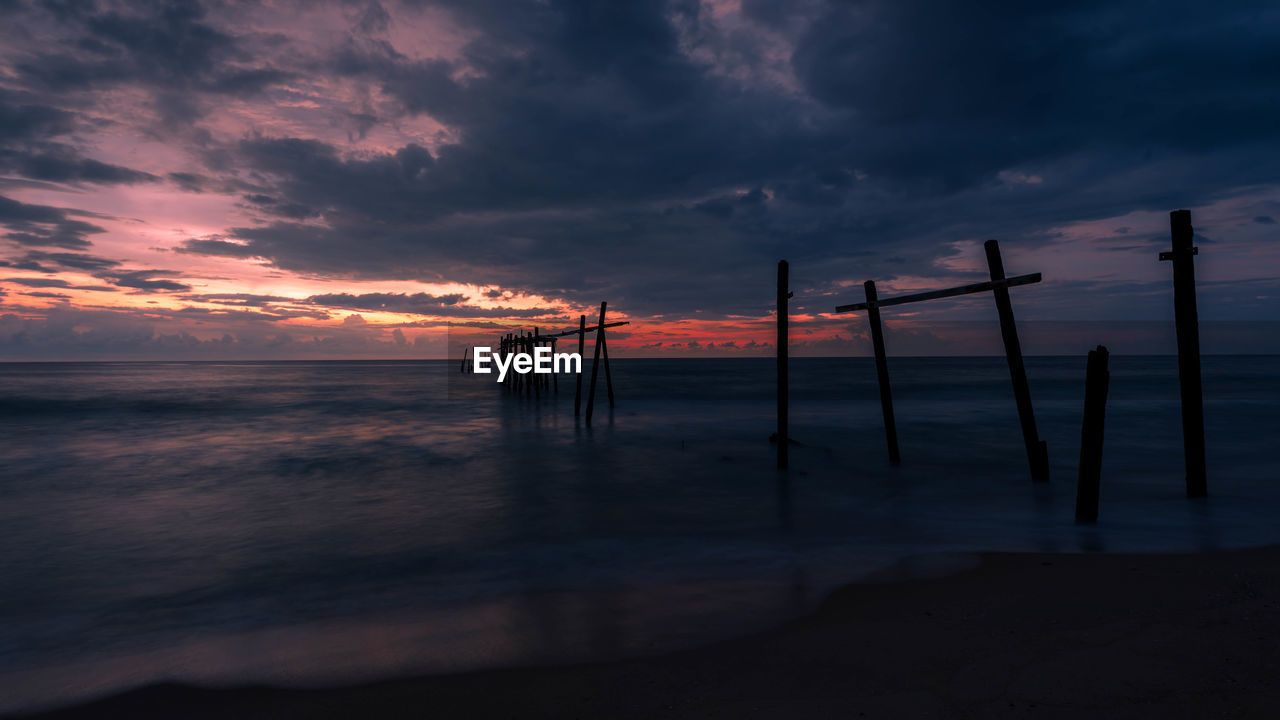 Scenic view of sea against dramatic sky