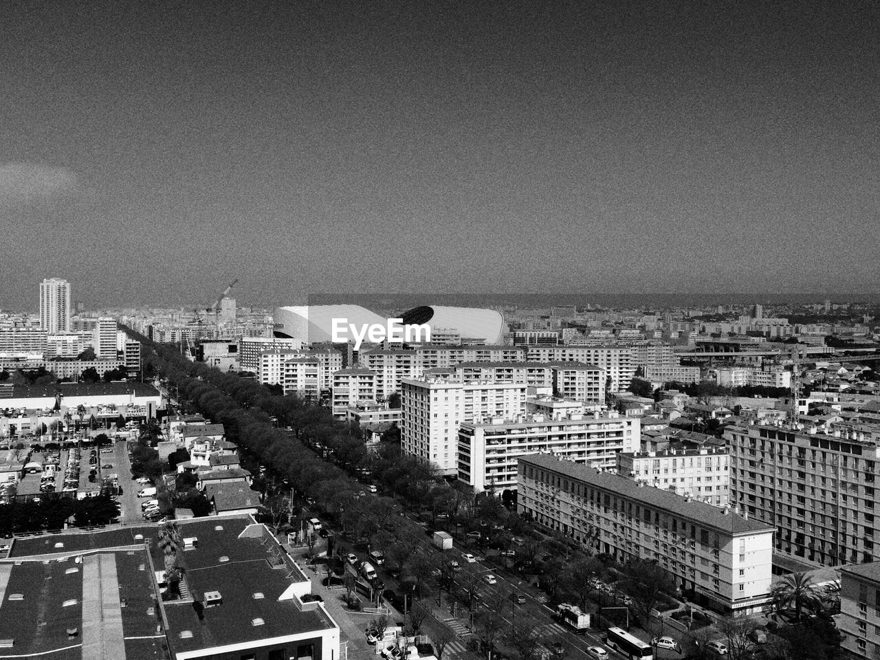 High angle view of buildings in city against sky