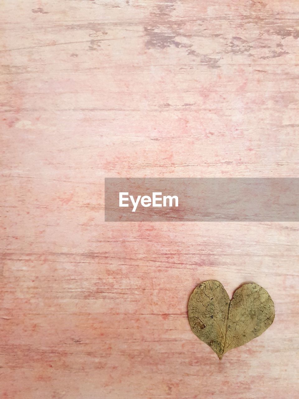 Close-up of heart shape leaf on table