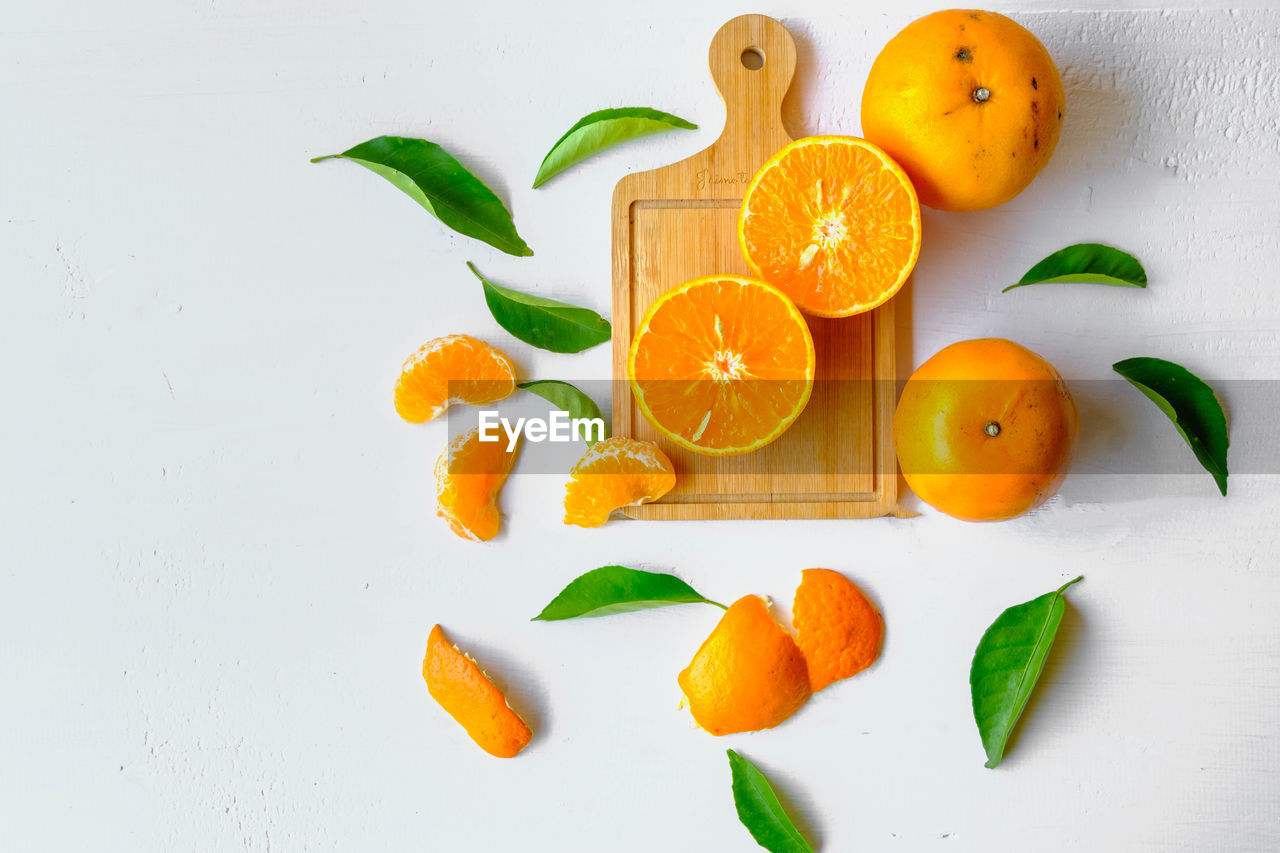 food and drink, food, healthy eating, fruit, freshness, plant, orange, orange color, citrus fruit, wellbeing, produce, leaf, plant part, clementine, no people, tangerine, citrus, studio shot, indoors, nature, still life, directly above, organic, vitamin