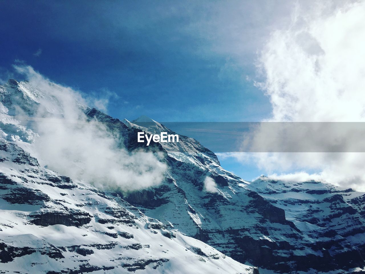 View of snow covered mountains against sky