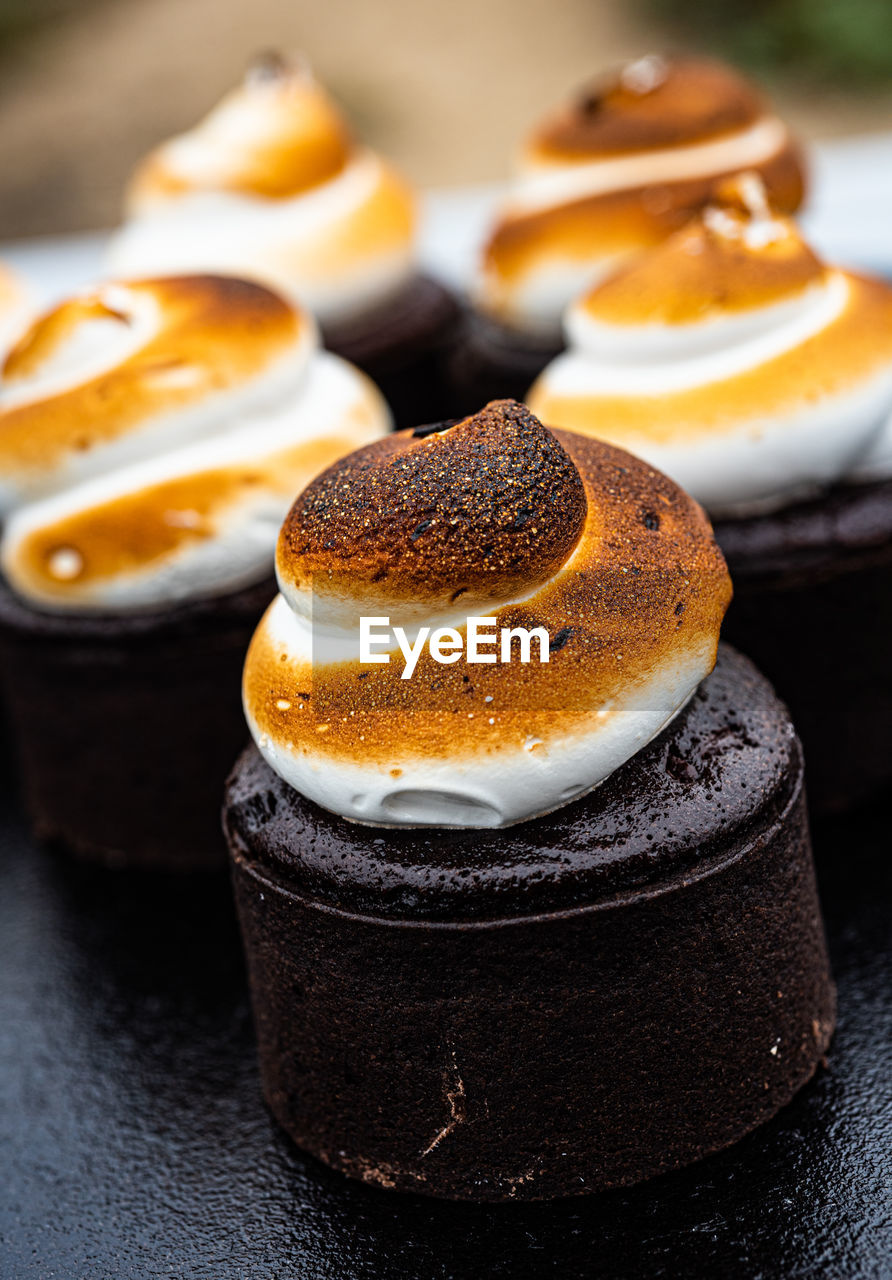 S'mores toasted marshmallow merengue swirls on chocolate brownie cakes