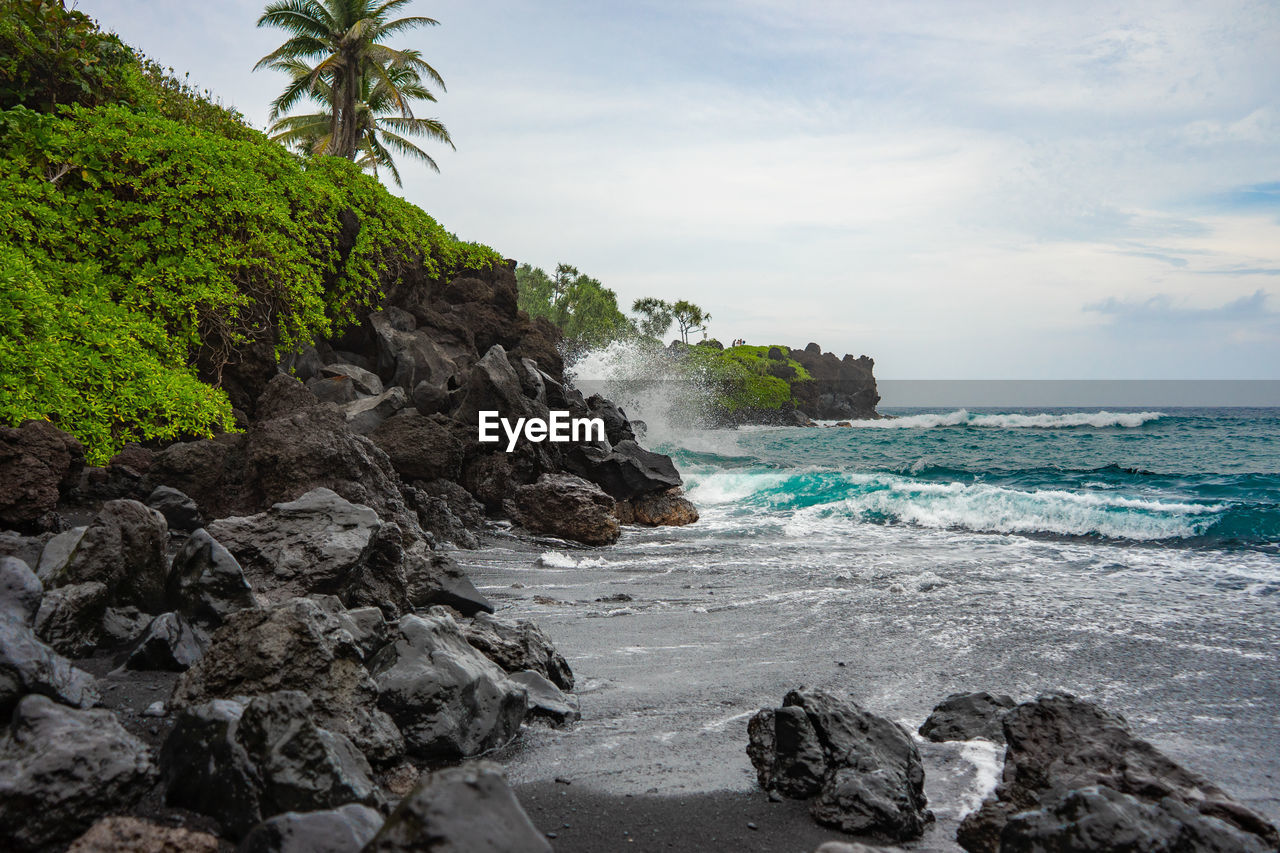 Scenic view of beach and sea against sky