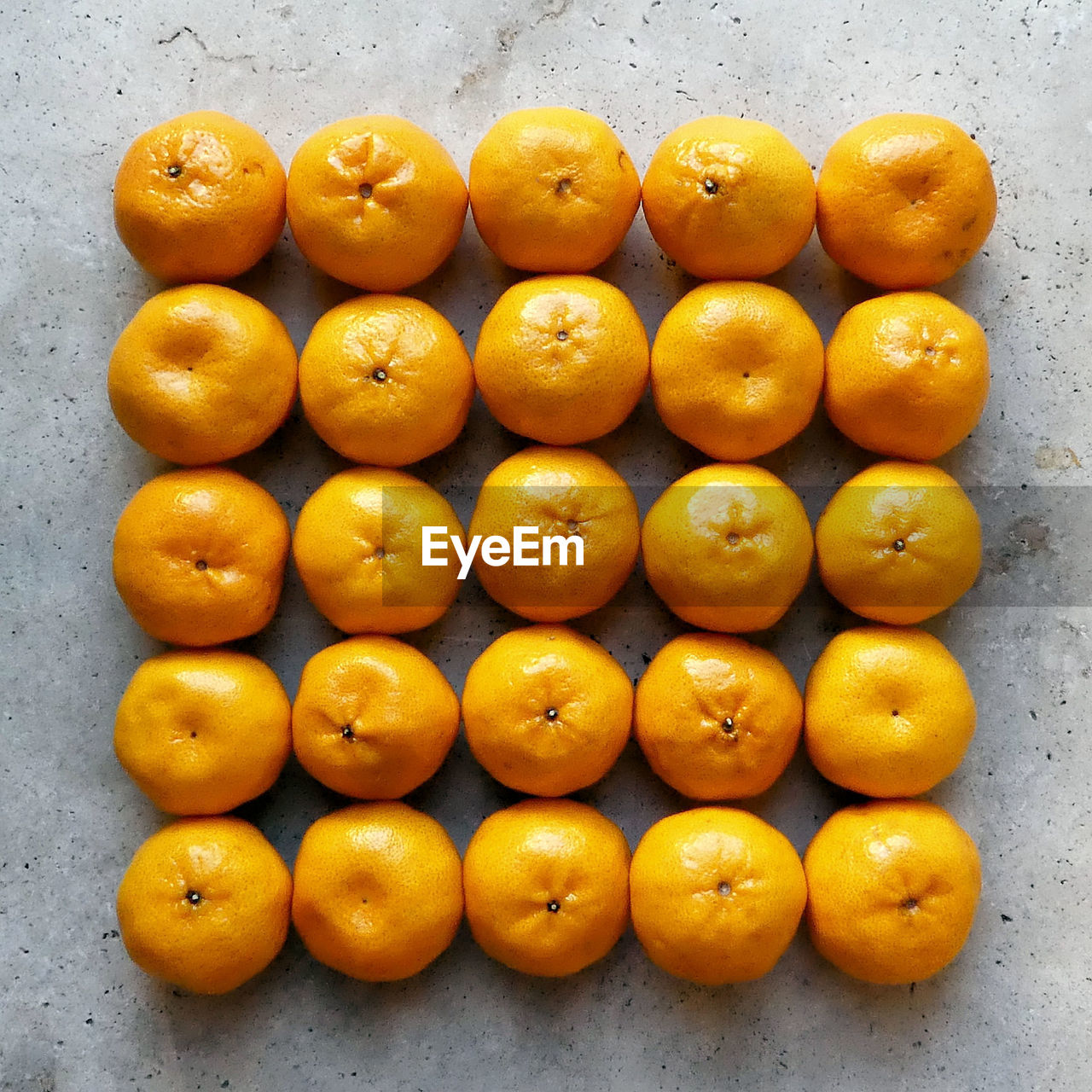 High angle view of oranges on stone table 