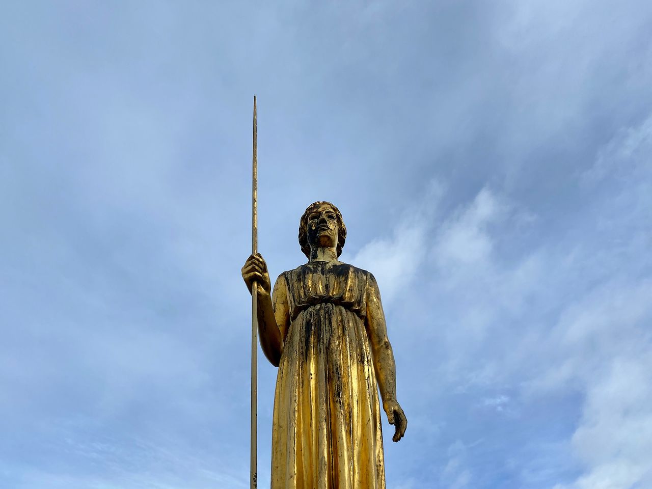 Low angle view of statue against sky