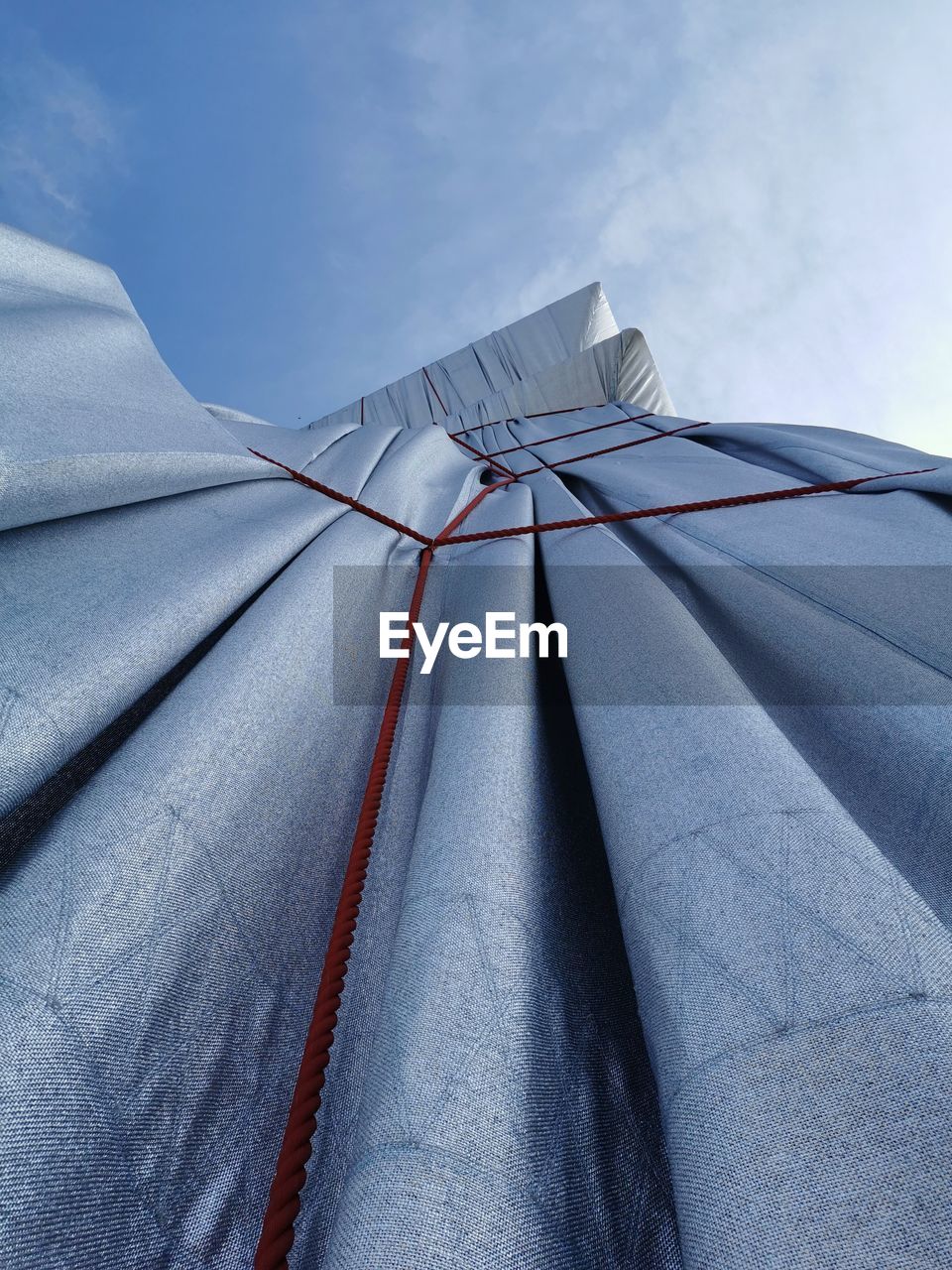 Low angle view of curtain against sky