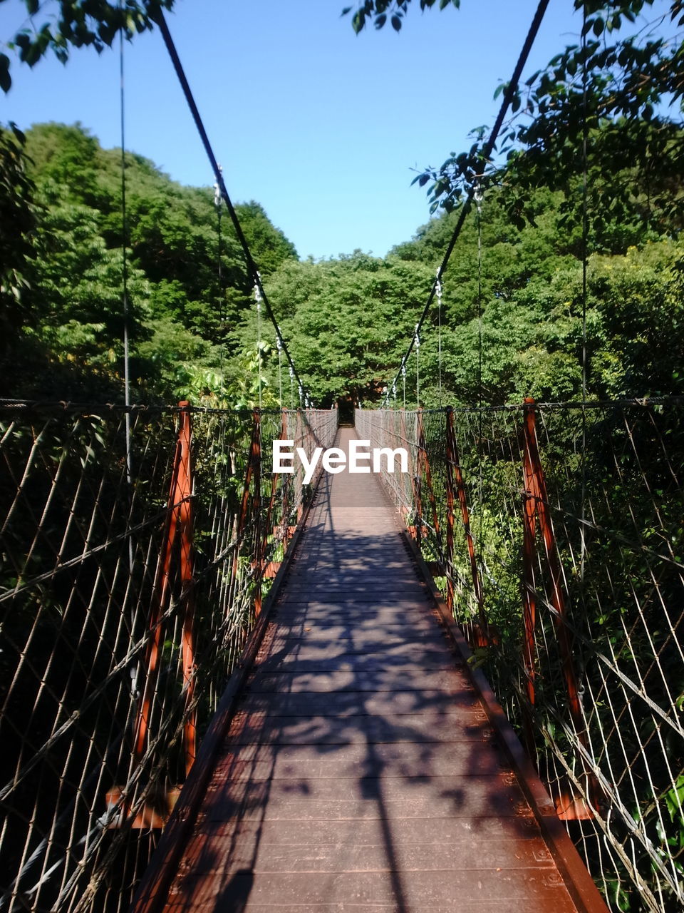 FOOTPATH BY FOOTBRIDGE AGAINST SKY