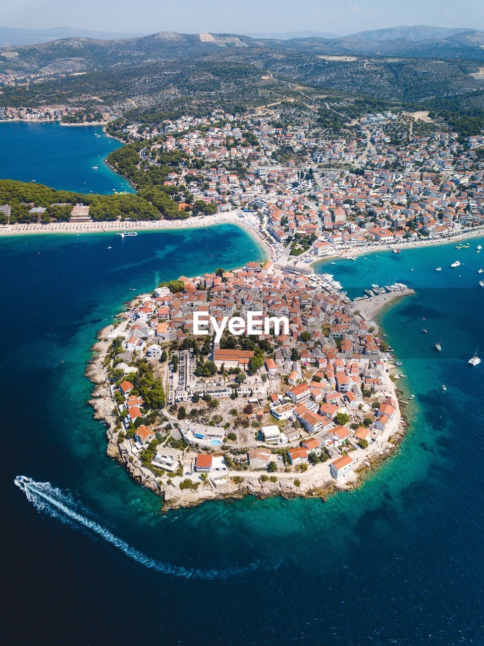 Aerial view of city by sea