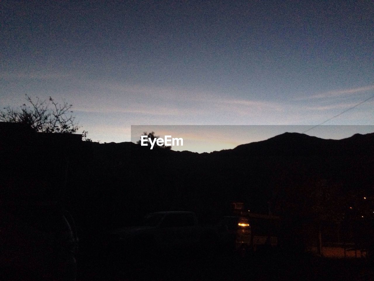 SILHOUETTE OF MOUNTAINS AT SUNSET