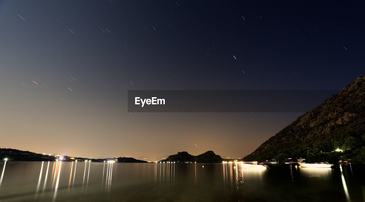 Scenic view of sea against sky at night