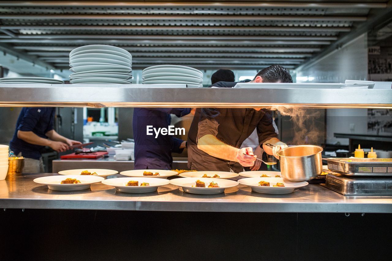 Chef serving food in restaurant