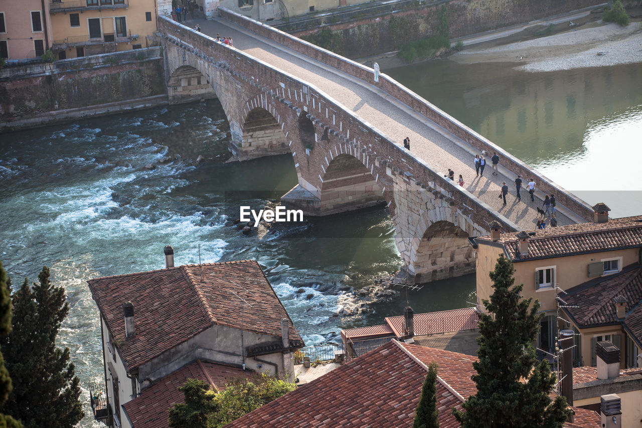 High angle view of people on ponte pietra over adige river