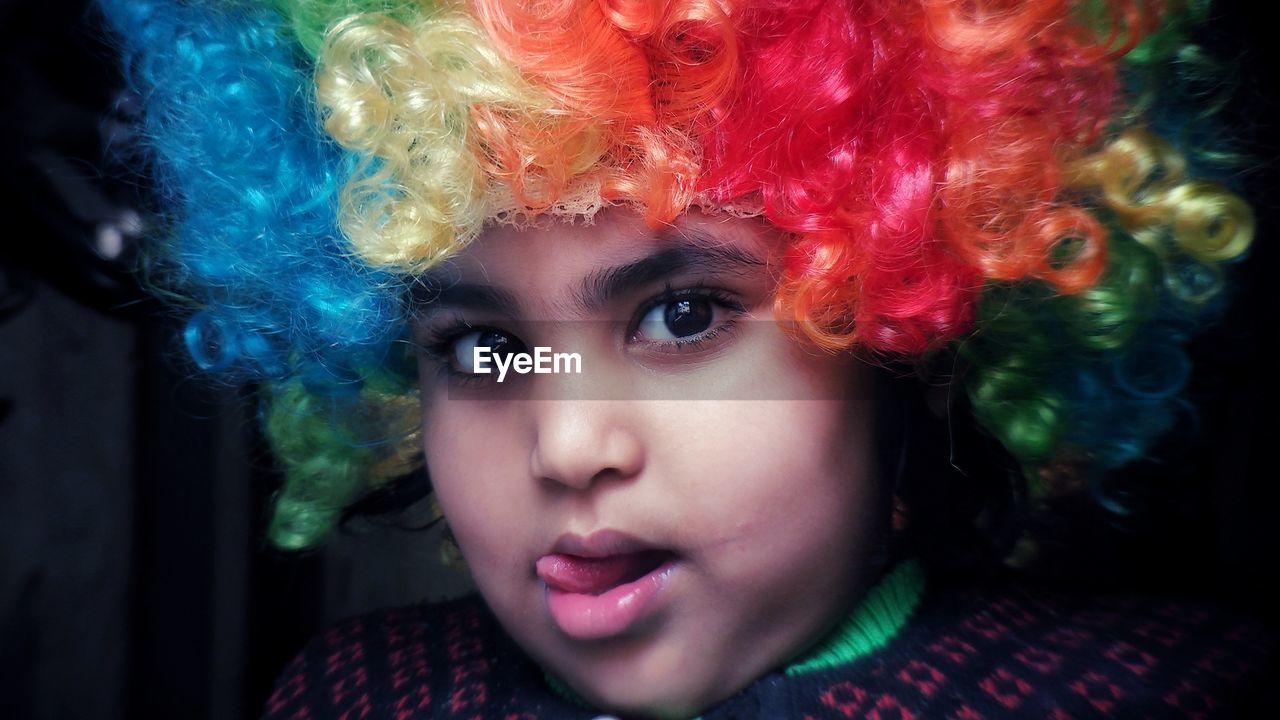 CLOSE-UP PORTRAIT OF BOY WITH MULTI COLORED