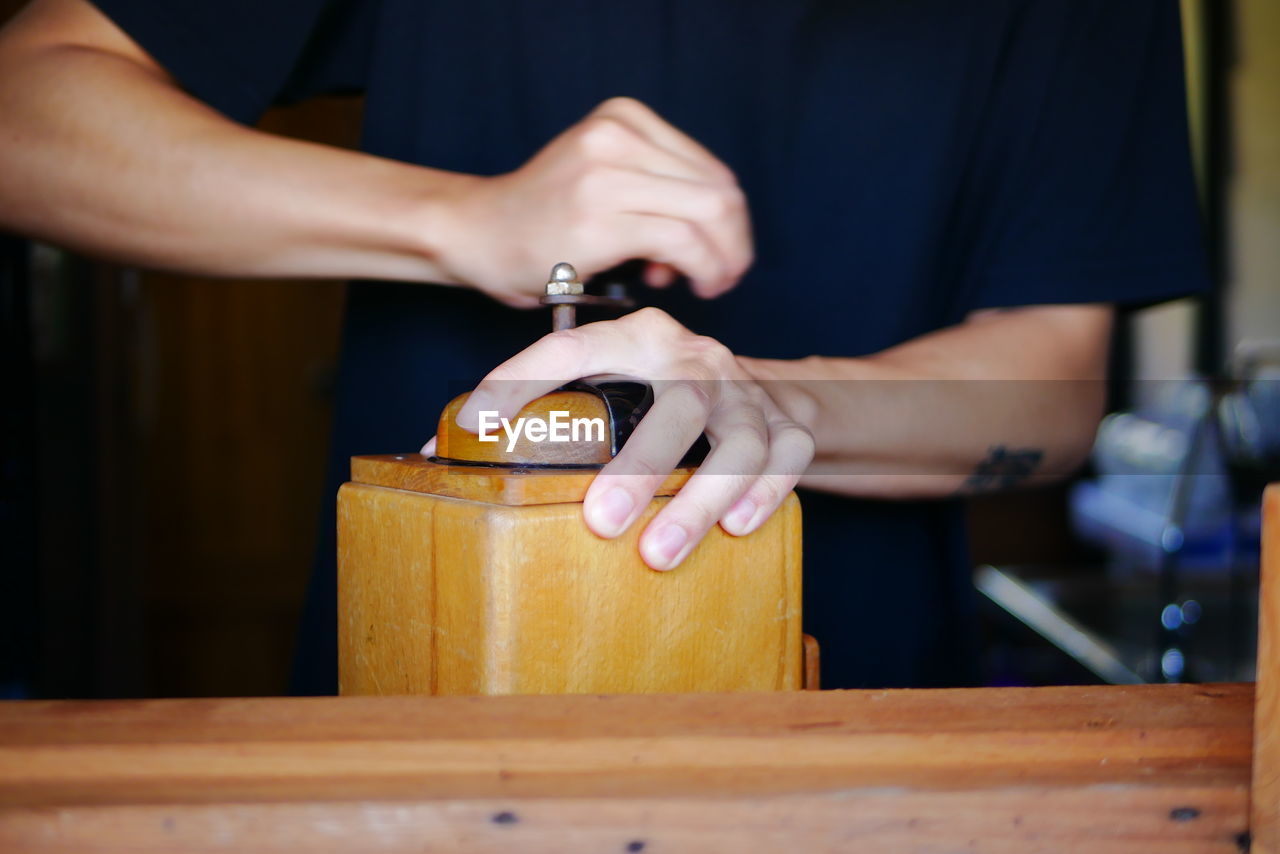 MAN WORKING ON TABLE