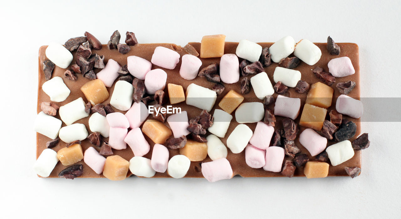 Handmade chocolates on white background